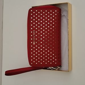 Michael Kors Wristlets leather wallet. New with tag. Red and with gold dots.